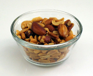 In a bag of mixed nuts, after shaking, smaller nuts fill in the gaps created at the bottom, pushing the larger Brazil nuts to the top. (image source: Melchoir, CC BY-SA 3.0 http://creativecommons.org/licenses/by-sa/3.0/, via Wikimedia Commons)
